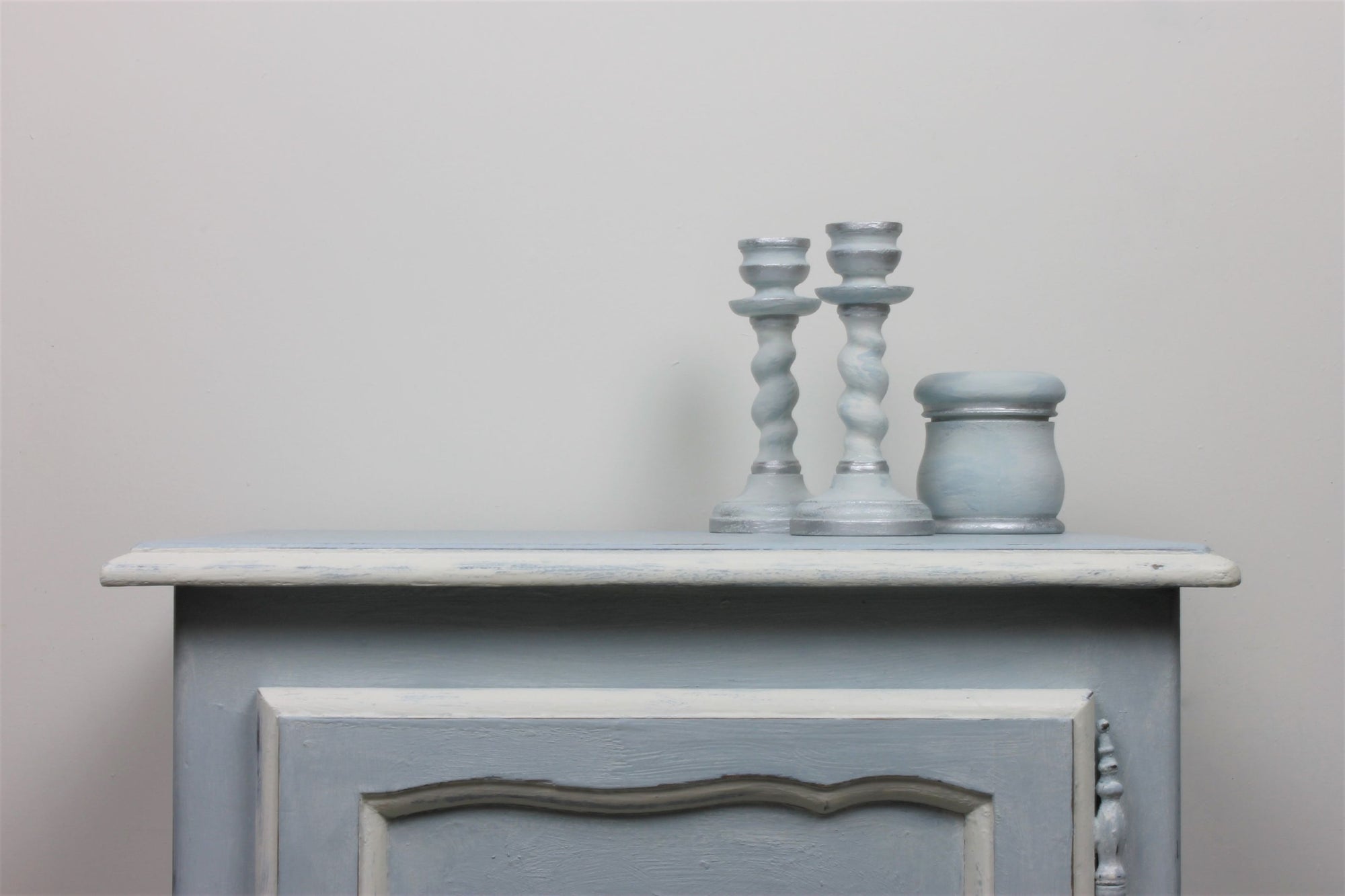 painted set of drawers decorated with painted ornaments
