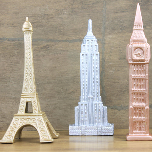 statues of the Eiffel Tower, Big Ben, and Empire State Building painted in metallics